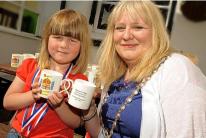 Above, Sophie, 4, is presented with her jubilee mug by mayor of Hayle Jayne Ninnes, and below, the mayor cuts the special jubilee cake at Angarrack. Above, Sophie, 4, is presented with her jubilee mug by mayor of Hayle Jayne Ninnes, and below, the mayor cuts the special jubilee cake at Angarrack.